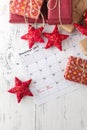 Decorations and calendar with Christmas Day marked out Royalty Free Stock Photo