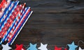 Decorations for 4th of July day of American independence, flag, candles, straws. USA holiday decorations on a wooden background, Royalty Free Stock Photo