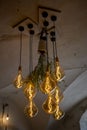 Decorative antique edison style filament light bulbs hanging from the ceiling Royalty Free Stock Photo