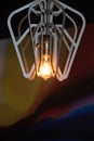 Decorative antique Edison style light bulb against a brown Royalty Free Stock Photo