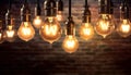 Decorative Antique Edison Style Light Bulbs Against Brick Wall Background for Vintage Lamp Enthusiasts. created with Generative AI Royalty Free Stock Photo