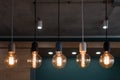 Decorative antique edison style light bulbs. Set of different vintage glowing light bulbs in loft interior Royalty Free Stock Photo