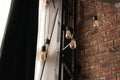 Decorative antique edison style light tungsten bulbs against brick wall Royalty Free Stock Photo