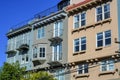 Decorative apartment complex buildings in downtown san francisco historic districts with metal balconies and windows Royalty Free Stock Photo