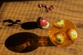 Decorative apples inside a glass container