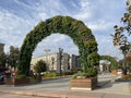 Decorative arch of flowers on Tverskoy Boulevard. Moscow, Russia, September 24, 2020. Mobile photo