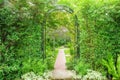 Decorative arched iron gateway to a garden Royalty Free Stock Photo