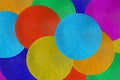 Decorative arrange of round colorful table mats, in a top view.