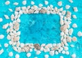 Decorative arrangement of sea shells on a blue background Royalty Free Stock Photo