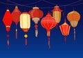 Decorative background with Chinese red paper street lanterns of various shapes and sizes. Backdrop with beautiful Royalty Free Stock Photo