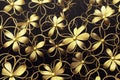 Decorative background with metallic flowers made of filigree gold wire on black Royalty Free Stock Photo