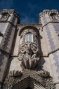 Decorative balcony at Pena Palace in Sintra, Portugal. Sculpture of Triton, gargoyle or devil Royalty Free Stock Photo