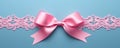 Decorative beautiful pink satin ribbon with bow for decorate gift box or greeting card on light blue background. Royalty Free Stock Photo