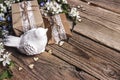 Decorative bird with apple blossom and gifts on old wooden background Royalty Free Stock Photo