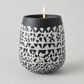 Decorative black candle holder with geometric pattern Royalty Free Stock Photo