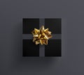 Decorative black gift box with realistic glittering golden bow