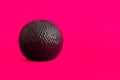 Decorative Black Sphere with Irregular Spiral Pattern on Pink