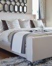 Decorative black tray of tea set on the bed in modern bedroom interior