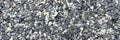 Decorative black and white pebble stones as background. Panorama