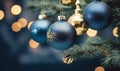 Decorative blue Christmas balls hanging on a Christmas tree.