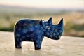 A decorative blue stone rhino