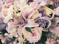 Decorative bouquet of lily and other beautiful flowers, adjusted to vintage color tone. Royalty Free Stock Photo