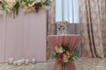 Decorative box, inscription Family Bank on pink tablecloth with flowers, candles on floor at pink wall with hanging decorative