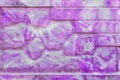 Decorative brick stone fence abstract purple pink spotted paint pattern modern interior wall texture background Royalty Free Stock Photo