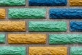 Decorative brick texture background. Stock photo multi-colored brick. Decorative brick poured out of forms