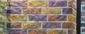 Decorative brick wall from concrete facing tiles as background or texture Royalty Free Stock Photo