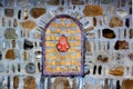 Decorative bricked window in a stone wall