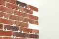 Decorative bricks with tile leveling system on white wall Royalty Free Stock Photo