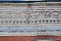 Decorative brickwork. Two-tone vintage grunge brick wall made of red and gray-white bricks. Background for home or office Royalty Free Stock Photo