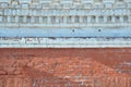 Decorative brickwork. Two-tone vintage grunge brick wall made of red and gray-white bricks. Background for home or office Royalty Free Stock Photo