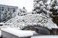 The decorative bridge with ornament is covered with snow in winter. Royalty Free Stock Photo