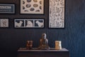 Decorative Bronze Budha Trinket on Wall Shelf of a Cafe Shop