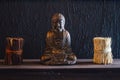 Decorative Bronze Budha Trinket on Wall Shelf of a Cafe Shop