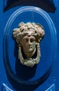 Decorative bronze door handle in the form of a beautiful woman`s Royalty Free Stock Photo