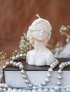 Decorative candle in form of woman bust. Soy candle handmade
