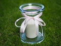 Decorative candle holder jar with pink bow Royalty Free Stock Photo