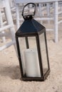 Decorative Candle Lantern on a Sandy Beach