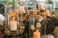 Decorative candles used as part of decor at a wedding reception. Example of wedding stylist work Royalty Free Stock Photo