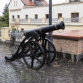 Decorative cannon in front of The State Philharmonics Sibiu - Thalia Concert Hall in the Cetatii street in a rainy day. Sibiu city