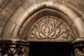 Decorative carved arch made of white marble over the entrance to the Christmas Cave in the Church of Nativity in Bethlehem in