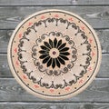 Decorative ceramic plate, hand painted dot pattern with acrylic paints on a gray wooden background. A square photo. Closeup Royalty Free Stock Photo