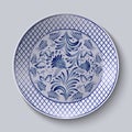 Decorative ceramic plate with a painting. Floral circular pattern in Gzhel style.