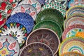 Decorative ceramic plates with traditional uzbek ornament in the street market of Bukhara. Uzbekistan