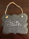 Decorative Chalkboard with Faith written on wood Background