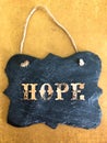 Decorative Chalkboard with HOPE spelled on Yellow Background