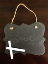 Decorative Chalkboard with a love written in chalk on Wood Background